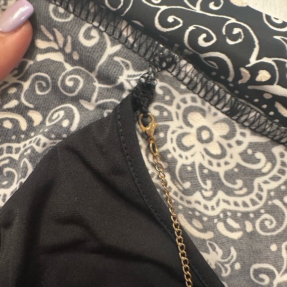 Elegant Black and White Blouse with Layered Design - Picture 5 of 11